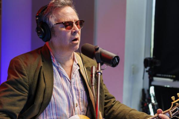 GRANT LEE PHILLIPS MEDIUM SHOT IN FRONT OF MICROPHONE 01